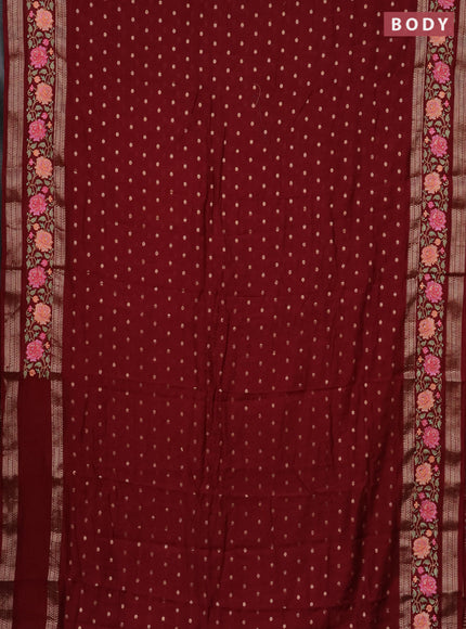 Semi chanderi saree maroon with allover zari woven buttas and floral embroidery border