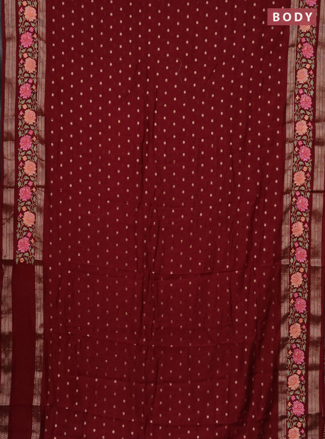 Semi chanderi saree maroon with allover zari woven buttas and floral embroidery border