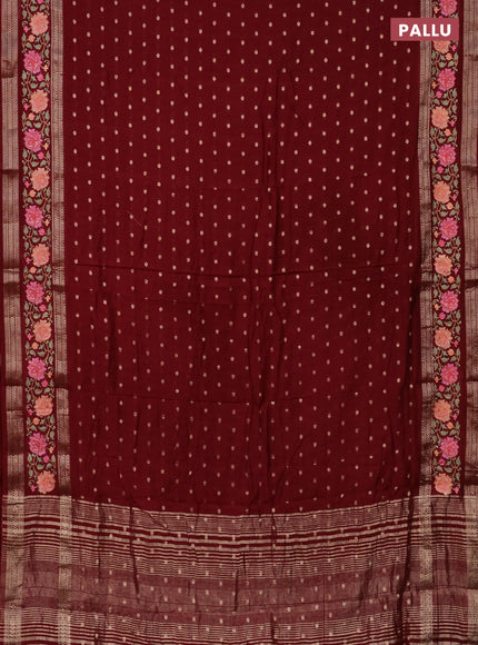 Semi chanderi saree maroon with allover zari woven buttas and floral embroidery border
