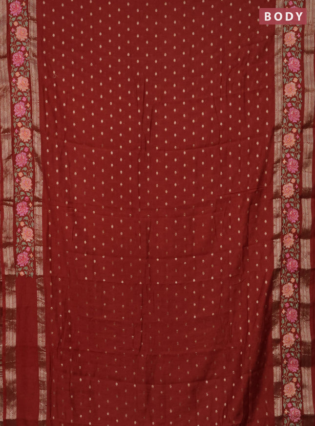 Semi chanderi saree rust shade with allover zari woven buttas and floral embroidery border