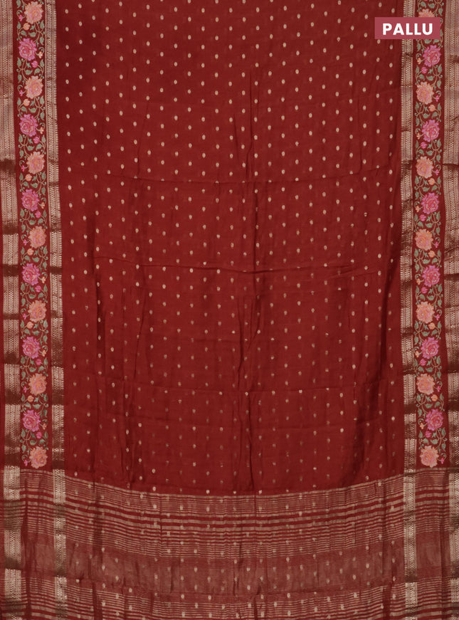 Semi chanderi saree rust shade with allover zari woven buttas and floral embroidery border