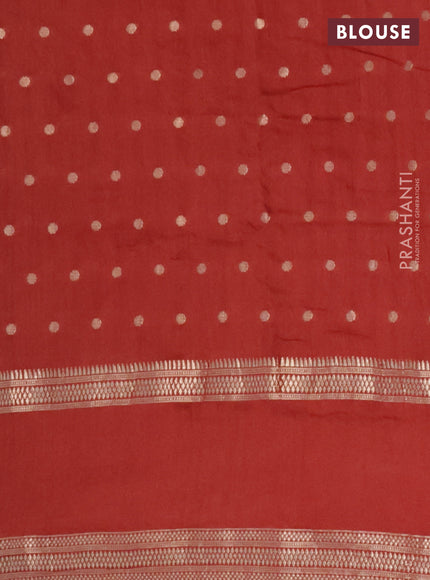 Semi chanderi saree rust shade with allover zari woven buttas and floral embroidery border
