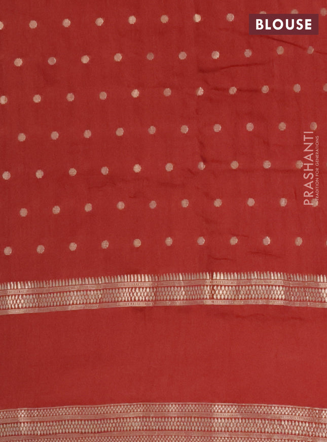 Semi chanderi saree rust shade with allover zari woven buttas and floral embroidery border