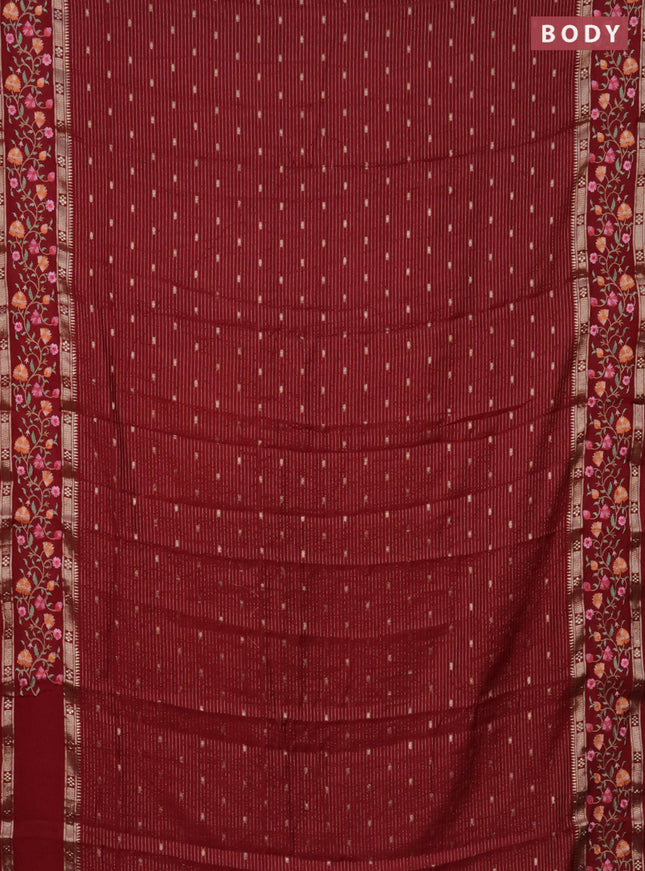 Semi chanderi saree maroon with allover zari weaves and floral embroidery border