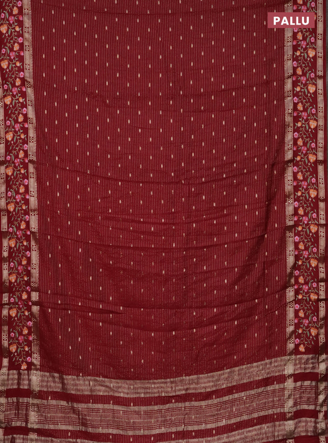 Semi chanderi saree maroon with allover zari weaves and floral embroidery border