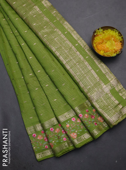 Semi chanderi saree light green with allover zari weaves and floral embroidery border