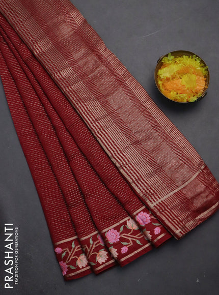 Semi chanderi saree maroon with allover zari weaves and floral embroidery border