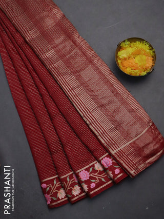 Semi chanderi saree maroon with allover zari weaves and floral embroidery border