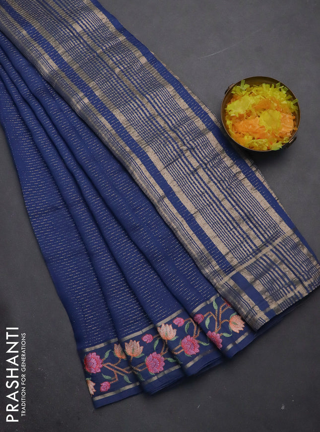 Semi chanderi saree blue with allover zari weaves and floral embroidery border