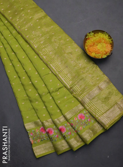 Semi chanderi saree fluorescent green with allover zari woven buttas and floral embroidery border