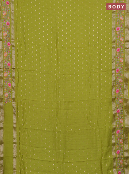 Semi chanderi saree fluorescent green with allover zari woven buttas and floral embroidery border