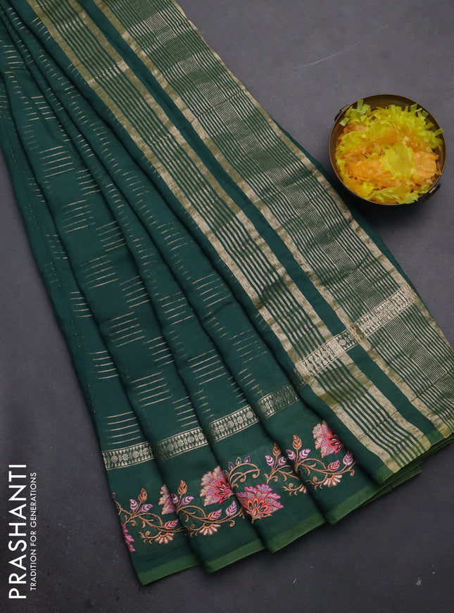 Semi chanderi saree green with allover zari woven geometric weaves and floral embroidery border