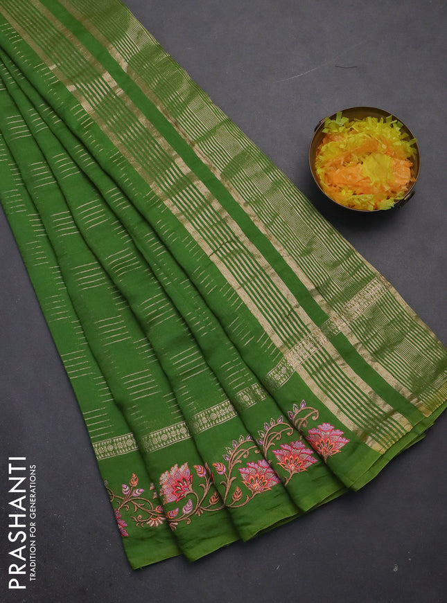 Semi chanderi saree green with allover zari woven geometric weaves and floral embroidery border