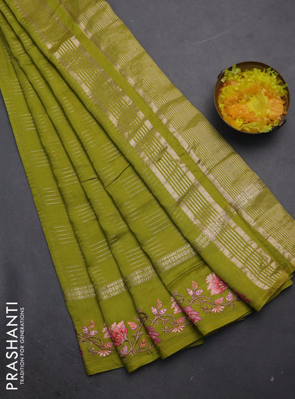 Semi chanderi saree lime green with allover zari woven geometric weaves and floral embroidery border