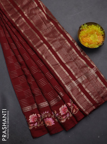 Semi chanderi saree maroon with allover zari woven geometric weaves and floral embroidery border