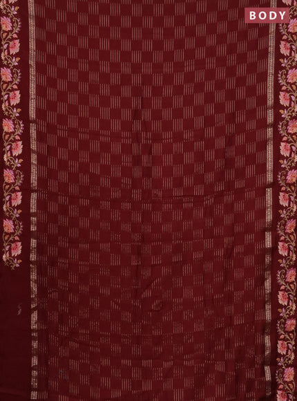Semi chanderi saree maroon with allover zari woven geometric weaves and floral embroidery border