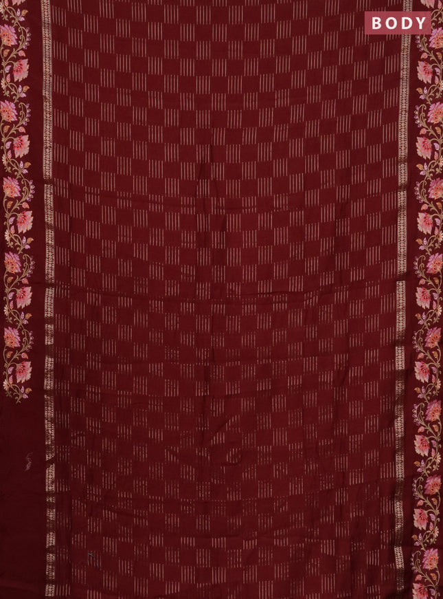 Semi chanderi saree maroon with allover zari woven geometric weaves and floral embroidery border