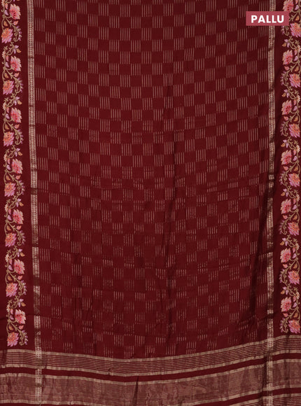 Semi chanderi saree maroon with allover zari woven geometric weaves and floral embroidery border