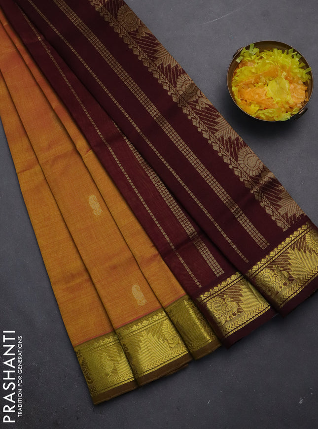 Silk cotton saree dual shade of mustard yellow and deep maroon with paisley zari woven buttas and zari woven border