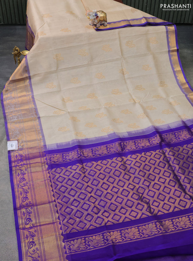 Silk cotton saree cream and blue with paisley zari woven buttas and long zari woven border