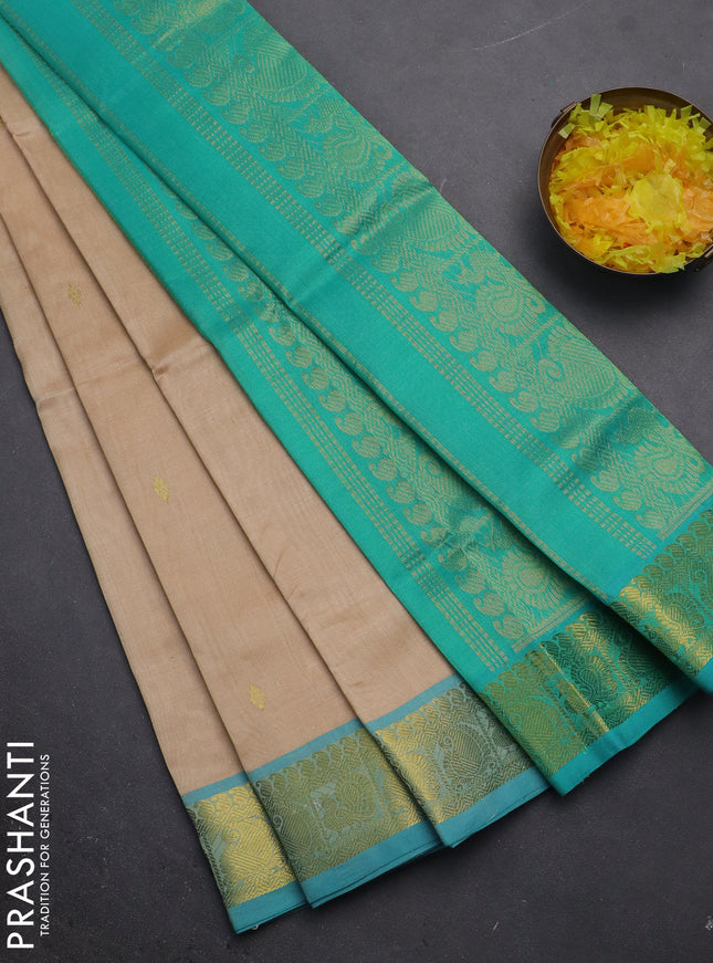 Silk cotton saree sandal and teal green with zari woven buttas and zari woven border