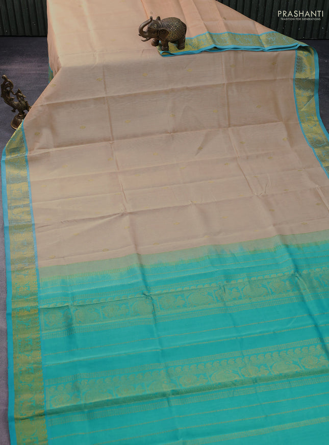 Silk cotton saree sandal and teal green with zari woven buttas and zari woven border