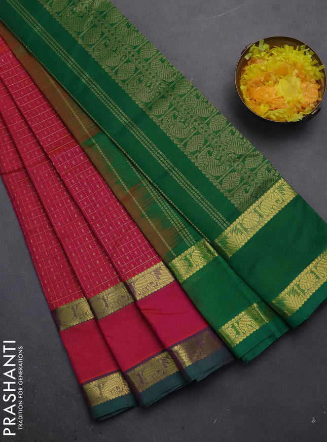 Silk cotton saree dual shade of pinkish orange and green with allover zari checks & lakshadeepam weaves and rettapet zari woven border