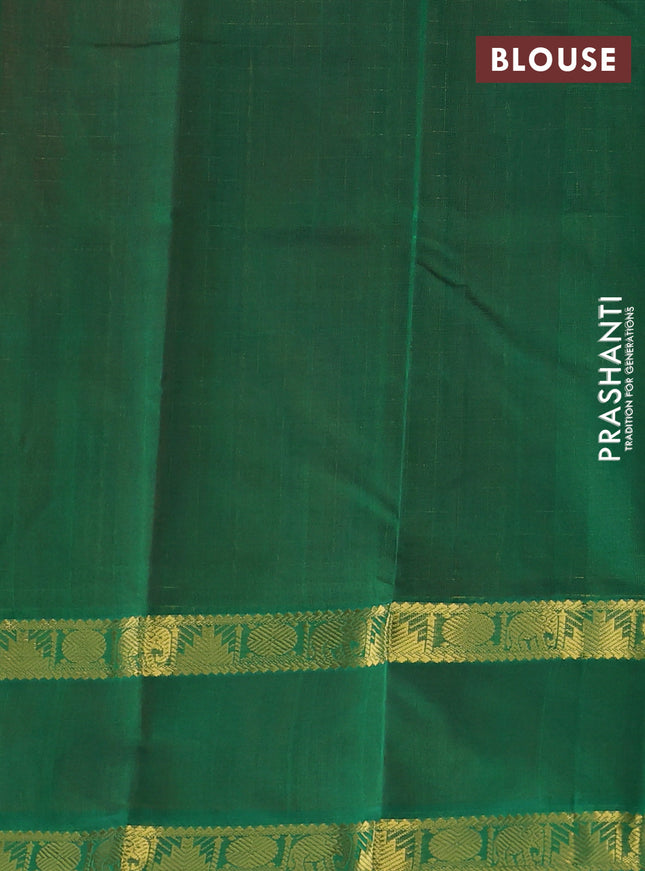 Silk cotton saree dual shade of pinkish orange and green with allover zari checks & lakshadeepam weaves and rettapet zari woven border