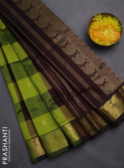 Silk cotton saree light green and coffee brown with allover paalum pazhamum checks & buttas and zari woven border