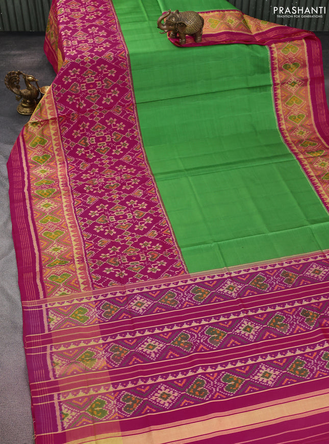 Rajkot patola silk saree green and pink with plain body and ikat woven zari border