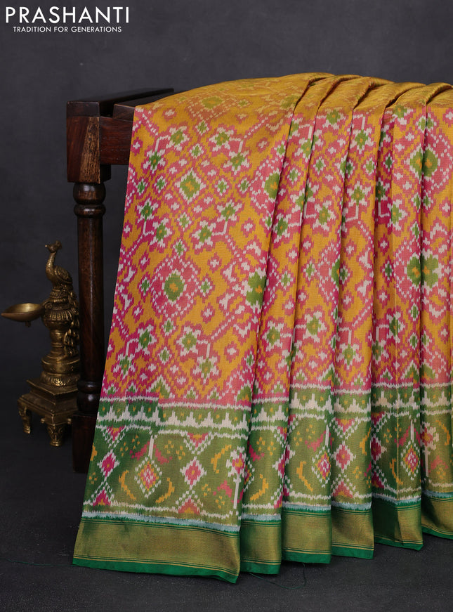 Rajkot patola tissue silk saree pink and green with allover ikat weaves and ikat woven zari border