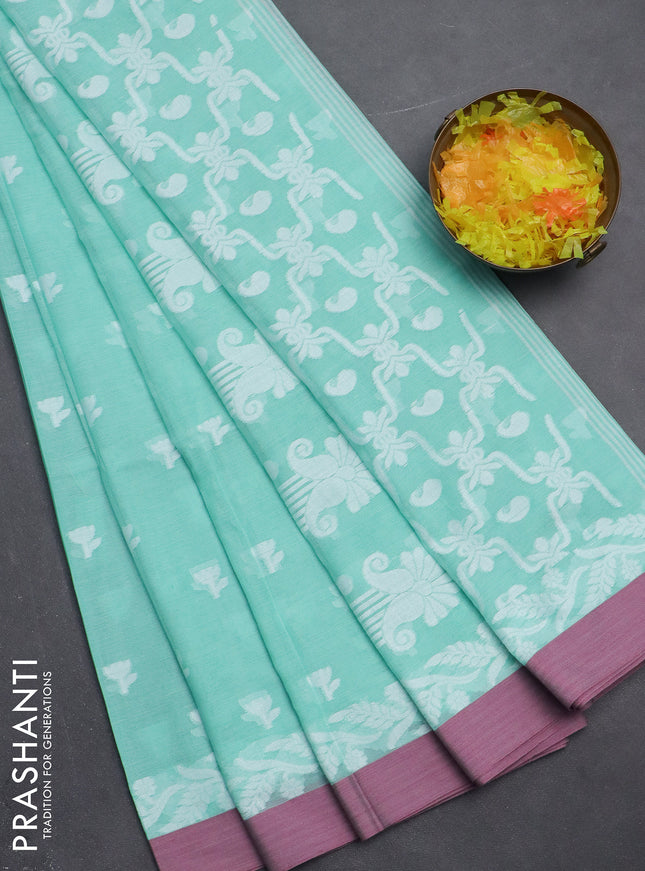 Khadi cotton saree teal green shade and mauve pink with allover thread woven floral buttas and simple border