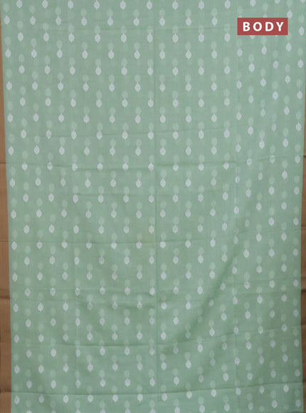 Khadi cotton saree green shade and sandal with allover thread woven ikat buttas and simple border