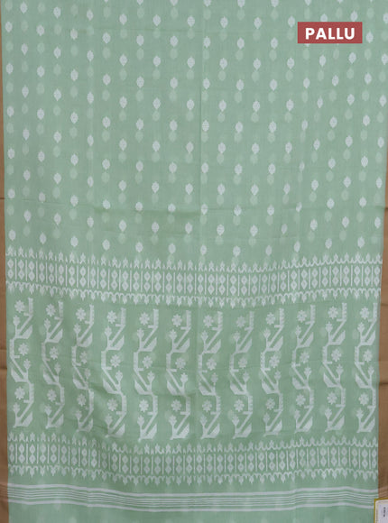 Khadi cotton saree green shade and sandal with allover thread woven ikat buttas and simple border
