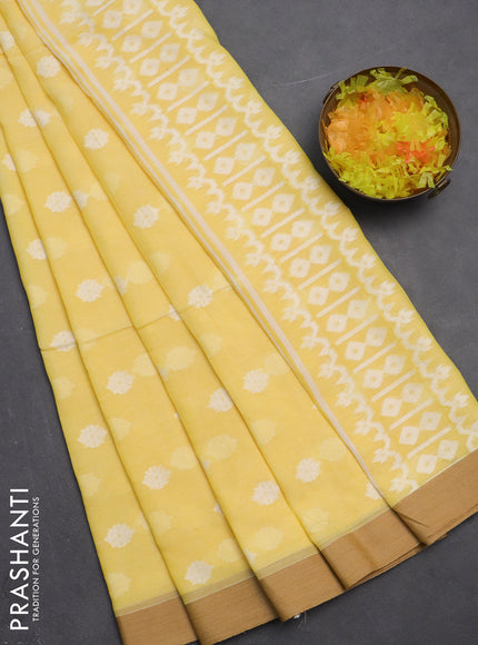 Khadi cotton saree pale yellow and sandal with allover thread woven ikat buttas and simple border