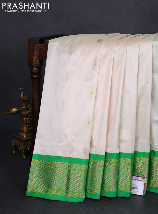 Pure paithani silk saree off white and green with annam zari woven buttas and zari woven korvai border