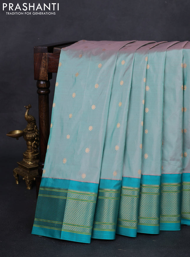 Pure paithani silk saree dual shade of greyish green and teal green with zari woven buttas and zari woven korvai border