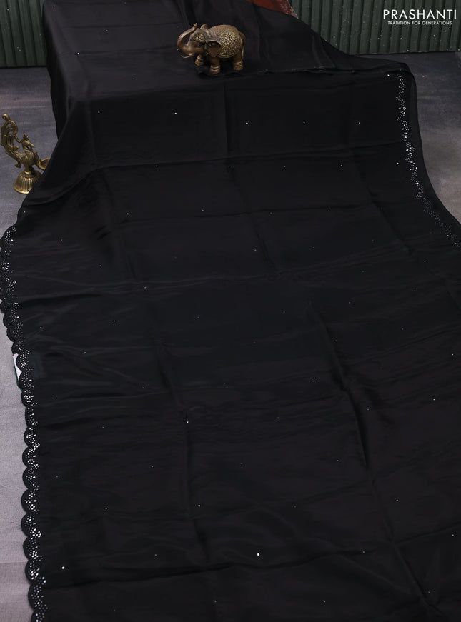 Satin crepe silk saree black and green with allover mirror work and ajrakh printed blouse