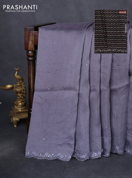 Satin crepe silk saree grey and black with allover mirror work and ajrakh printed blouse