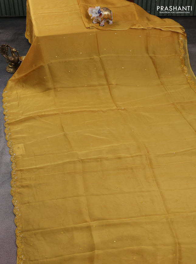 Satin crepe silk saree mustard yellow and green with allover mirror work and ajrakh printed blouse