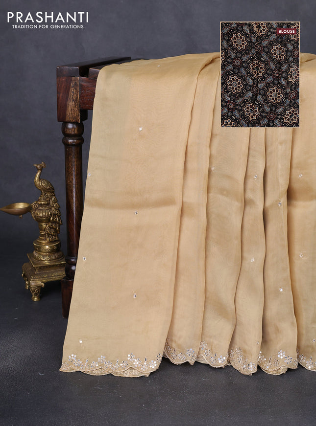 Satin crepe silk saree sandal and black with allover mirror work and ajrakh printed blouse