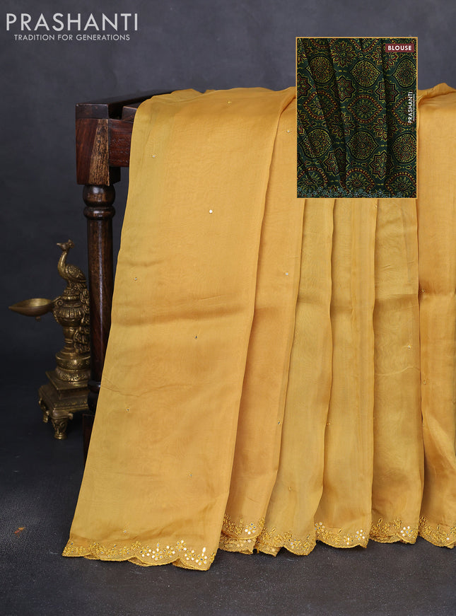 Satin crepe silk saree yellow and green with allover mirror work and ajrakh printed blouse