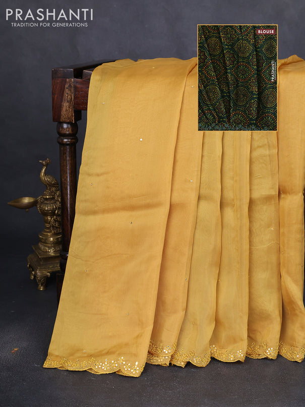 Satin crepe silk saree yellow and green with allover mirror work and ajrakh printed blouse