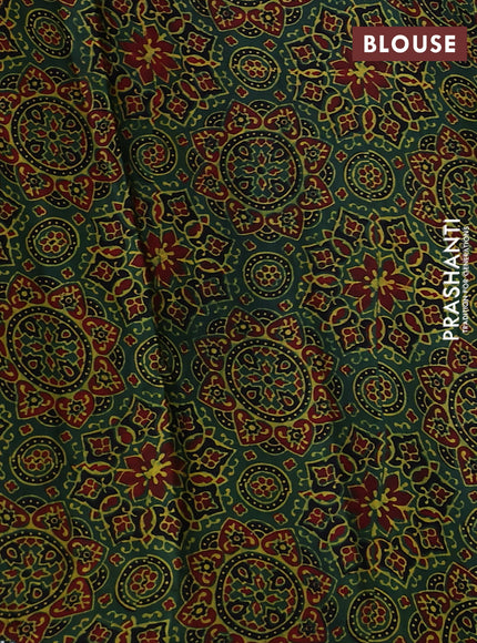 Satin crepe silk saree black and green with allover mirror work and ajrakh printed blouse