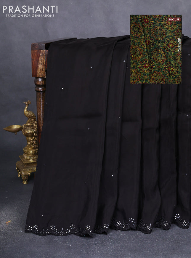 Satin crepe silk saree black and green with allover mirror work and ajrakh printed blouse