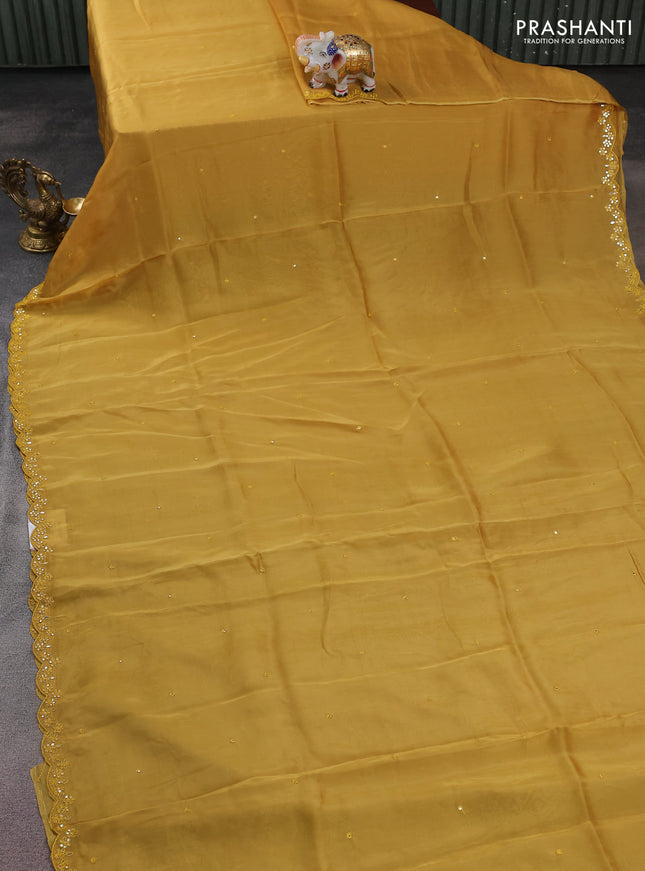 Satin crepe silk saree yellow and green with allover mirror work and ajrakh printed blouse