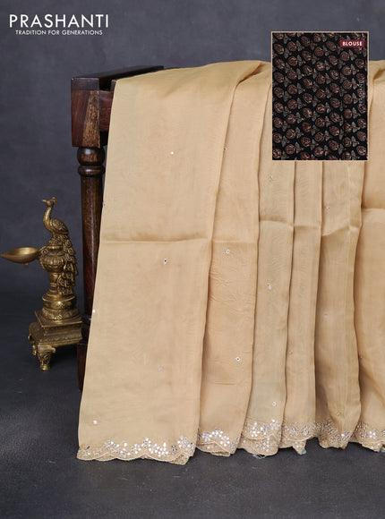 Satin crepe silk saree sandal and black with allover mirror work and ajrakh printed blouse