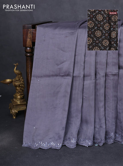 Satin crepe silk saree grey and black with allover mirror work and ajrakh printed blouse