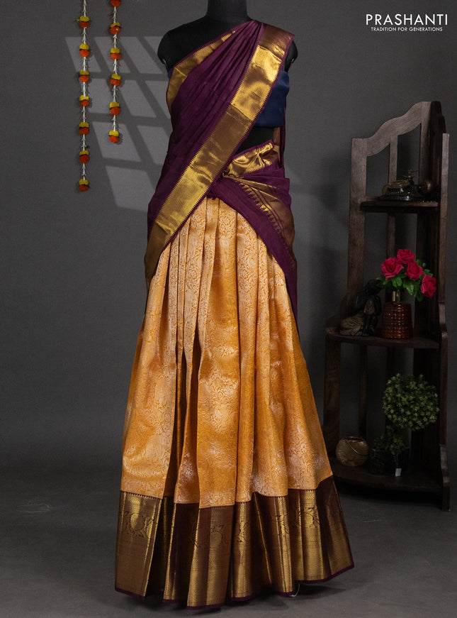 Pure silk lehenga dhawani mustard yellow and wine shade with allover zari woven elephant brocade weaves and long rich zari woven border