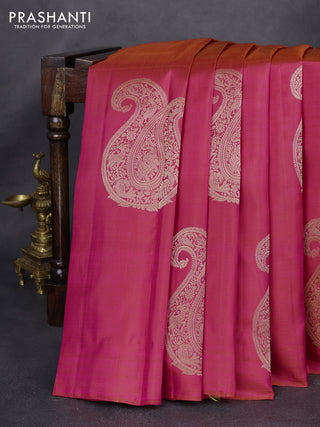 Pure kanchipuram silk saree dual shade of pinkish orange and light green with paisley zari woven buttas in borderless style